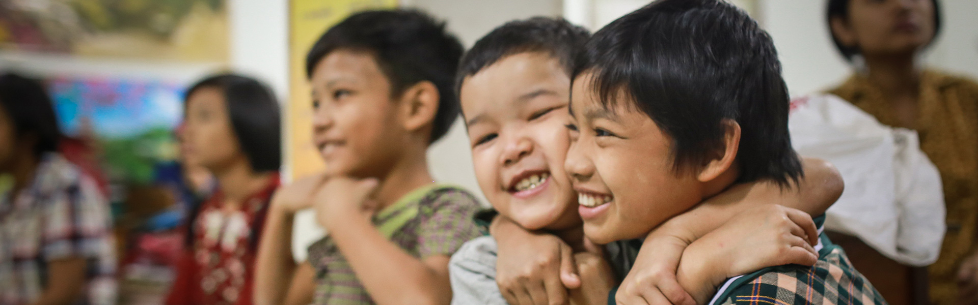 Kindergarten children hugging